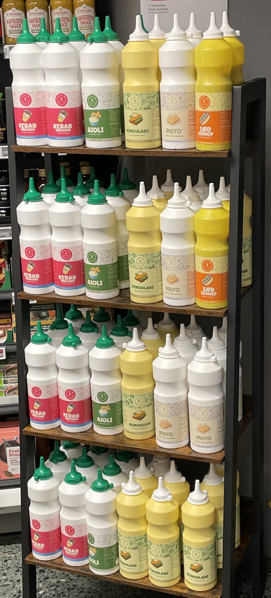 Kebab Dressing, Aioli, Remoulade, Mayo and Sød Sennep on a store rack