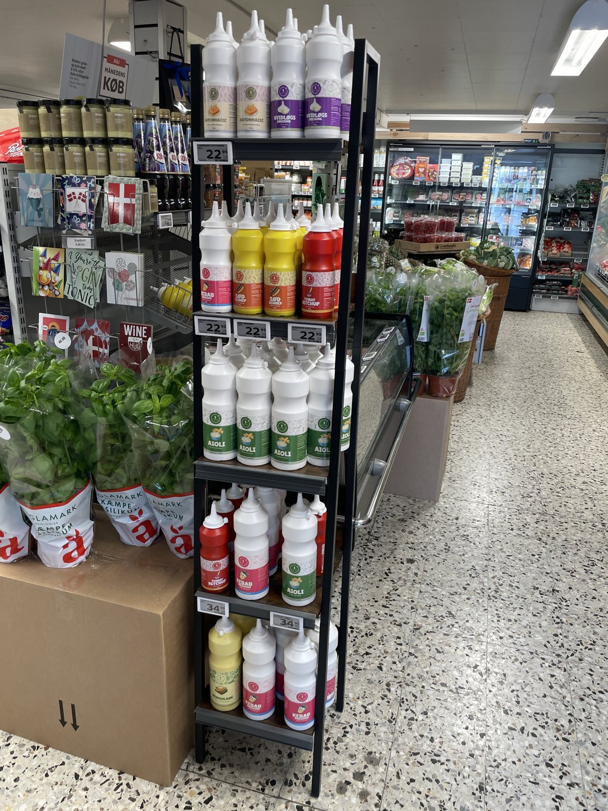 1 Dressing rack with mayonnaise, garlic dressing, Sød Sennep, ketchup and aioli in a Danish store