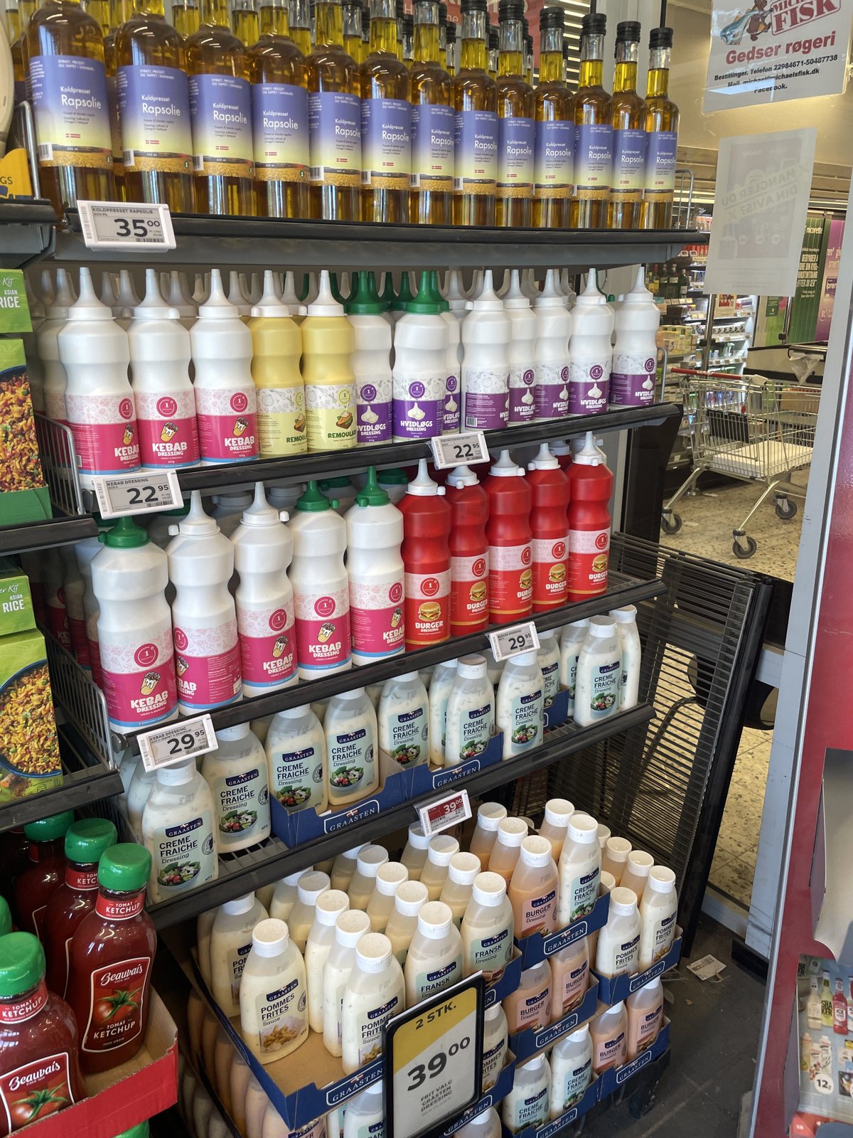 Kebab Dressing, Burger Dressing and garlic dressing on a supermarket shelf